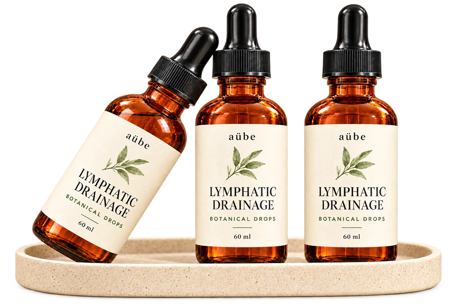 Three matching aübe 60 ml amber dropper bottles arranged on a cream stone tray